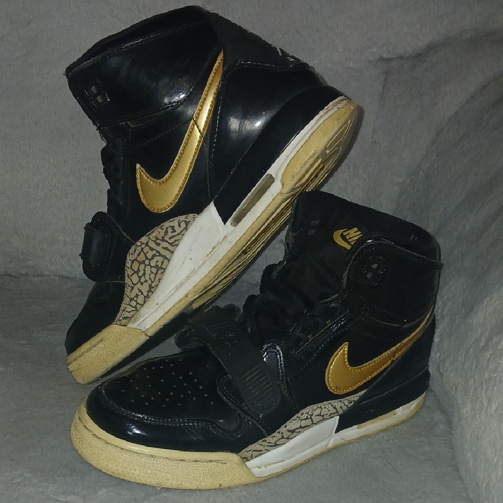 Nike Black and Gold High-Tops